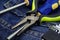 Light green pens pliers screwdriver set repair tools collection furniture construction background background