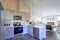 Light grey kitchen room interior with vaulted ceiling