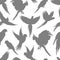 Light grey parrots silhouette seamless pattern