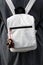 Light grey small unisex classic vintage retro design backpack with zipper closure and small miniature plush bear pendant