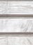 Light grey white marble engraved surface close up