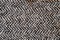 Light grey woolen or tweed fabric for grunge background