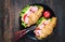 Light and hearty spring breakfast. Croissant with ham, cheese, fresh tomatoes on a wood stone table