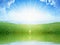 Light from heaven, bright sunlight with reflection in water, green grass on meadow