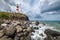 Light House Of Albion or Pointe aux Caves on Mauritius island landscape photo with foamy surf waves coast. Traveling around the