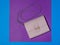 Light leather women`s bag on blue and lilac background. Modern women`s leather accessory. The view from the top