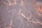 Light maroon marble, natural stone texture with beige veins