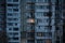 Light in one window in apartment multistorey building during the rolling blackout of electricity in a residential area of Kyiv