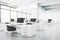 Light open space office with modern white tables and black chairs on glossy concrete floor and glass wall conference room