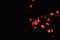 Light orange star light effect isolated overlay glitter texture on black