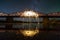 Light painting art concept. Spinning steel wool in abstract circle, firework showers of bright yellow glowing sparkles on long br