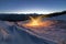 Light painting art. Spinning steel wool in abstract circle, firework showers of bright yellow glowing sparkles on winter snowy