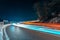 Light painting fast cars drive on mountains road