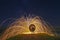 Light Painting with fire circle and two lovers and sky full of stars