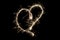 Light painting heart shape over black