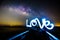 Light painting the LOVE word and milky way