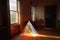 light passing through a prism, dispersing into rainbow spectrum