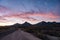 Light Pink Clouds Hang Over The Chisos Mountains At Sunrise