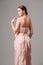 Light pink cocktail ruffled dress. Romantic backless evening gown