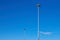 Light poles, copy space. LED light post for parking lot, blue sky background. Lamppost for street lighting at night