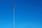 Light poles, copy space. LED light post for parking lot, blue sky background. Lamppost for street lighting at night