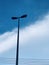 Light poles. Street lamp against blue sky background