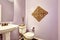 Light purple bathroom with white washbasin stand