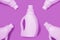 Light purple bottles on purple background. Cleaning concept