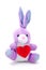 Light purple toy bunny rabbit sitting with heart.