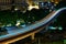 Light rail transit train moving through the city in the night