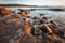 light on the rocks at umina beach in australia