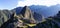 Light shines on famous ruins in peru with many tourists exploring