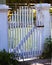 Light Shines Through Picket Fence Gate