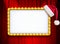 Light sign with gold frame and Christmas hat on red theatre or cinema curtain