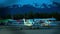 Light single-engine planes and car parked the night at the Alaska airport