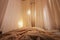 Light, soft transparent curtains in room. Canopy around bed with gentle light and blurring in evening. Boudoir. Concept