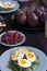 A light summer dinner for two: boiled eggs with arugula and avocado, raspberries for dessert, purple pears and white wine.