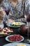 A light summer dinner for two: boiled eggs with arugula and avocado, raspberries for dessert, purple pears and white wine.