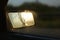 Light of the sun in a broken rearview mirror.