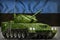 Light tank apc with pixel summer camouflage on the Estonia national flag background. 3d Illustration