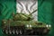 Light tank apc with summer camouflage on the Nigeria national flag background. 3d Illustration