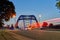 Light traces of cars in front of the bridge over the river Weser in Hoya, Germany at dusk