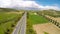 Light traffic on toll highway, road in green hilly areas of Cyprus, aerial view