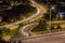 Light trails from cars going around corners at night in Hamilton, Ontario