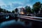 Light trails at the Leidsegracht and Keizersgracht canals in Amsterdam at dusk. Long exposure shot