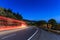 Light trails on a moonlit road