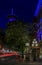 Light trails after sunset by the steam clock in Gastown with the Vancouver Lookout tower in the background, Canada