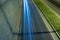 Light trails on the underpass road at night. Traffic or highway background photo.