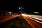 Light trails from vehicles crossing two lanes in serang