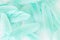 Light turquoise emerald green feathers background